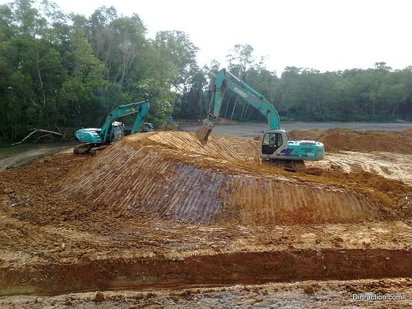 excavator shaping the berms